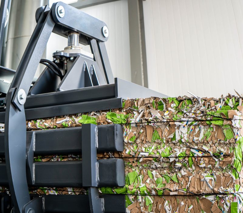 paper recycling truck and forklift loading old papers reuse